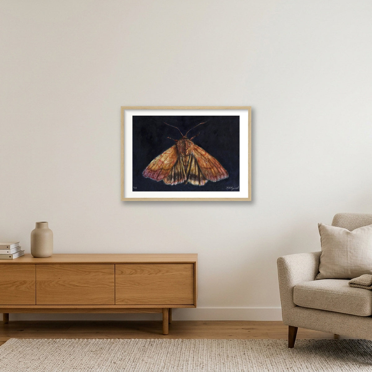 A fine art oil painting reproduction of a sallow bordered moth on a dark indigo background, by artist E L Heywood in a large oak frame

